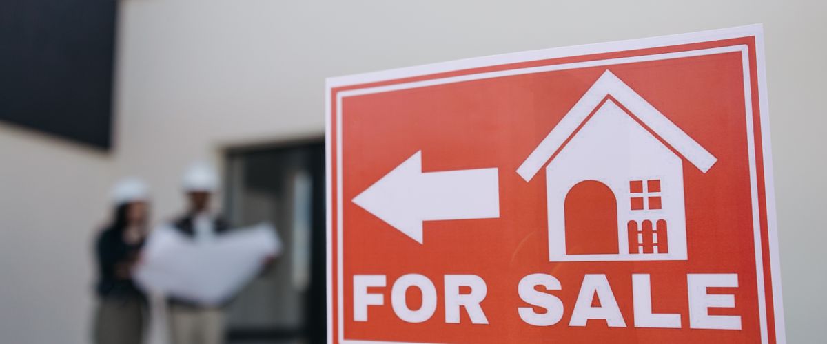 A for-sale sign outside a home