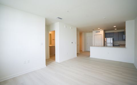 Empty high-rise living room, the kind of unit psf is quoted on